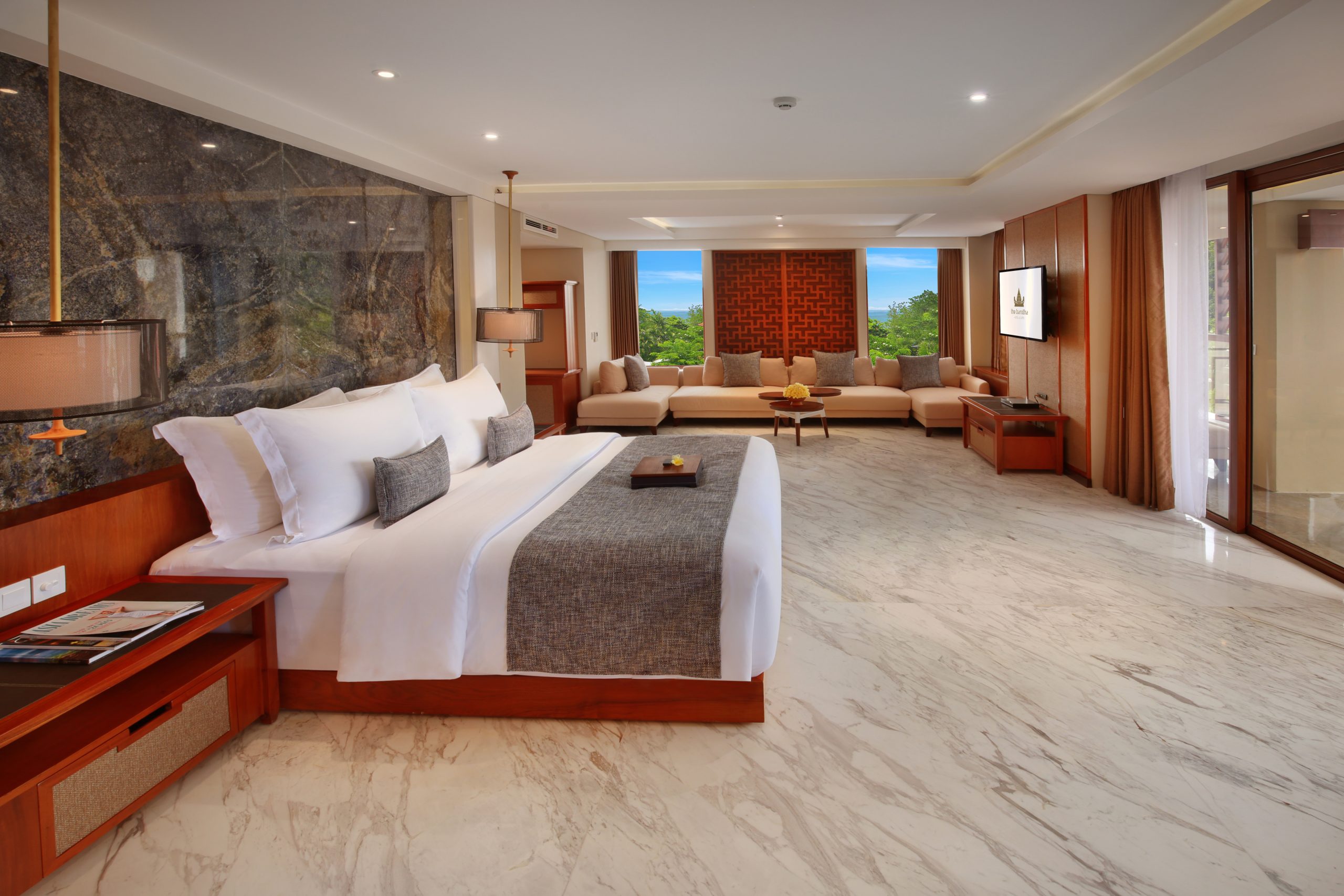 Grand suite with ocean view, king bed, and spacious living area.
