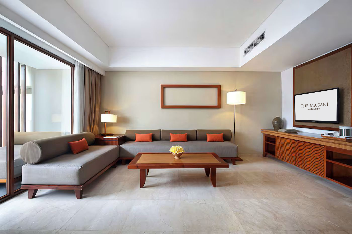 Magani Suite living area with sofa and minimalist decor.